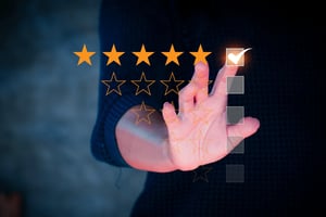 vecteezy_customer-review-concept-businessman-hand-with-rating-stars_22330500