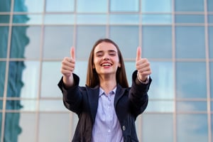 vecteezy_portrait-of-a-successful-business-woman-smiling-showing_14260620